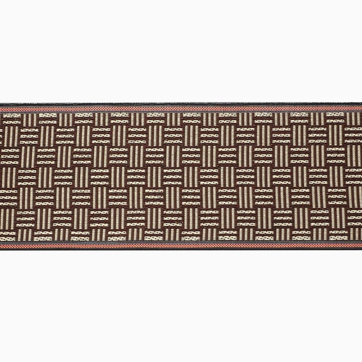 a brown and white woven textile with a repeating pattern of vertical lines and dots.