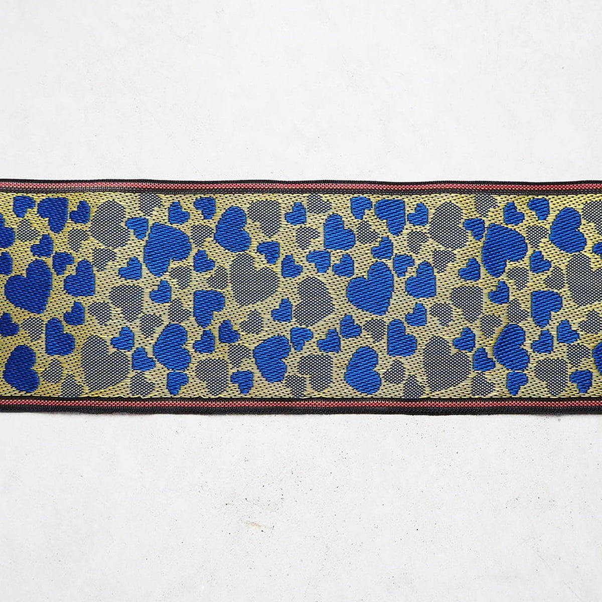 a ribbon with a heart pattern in blue and gray colors.